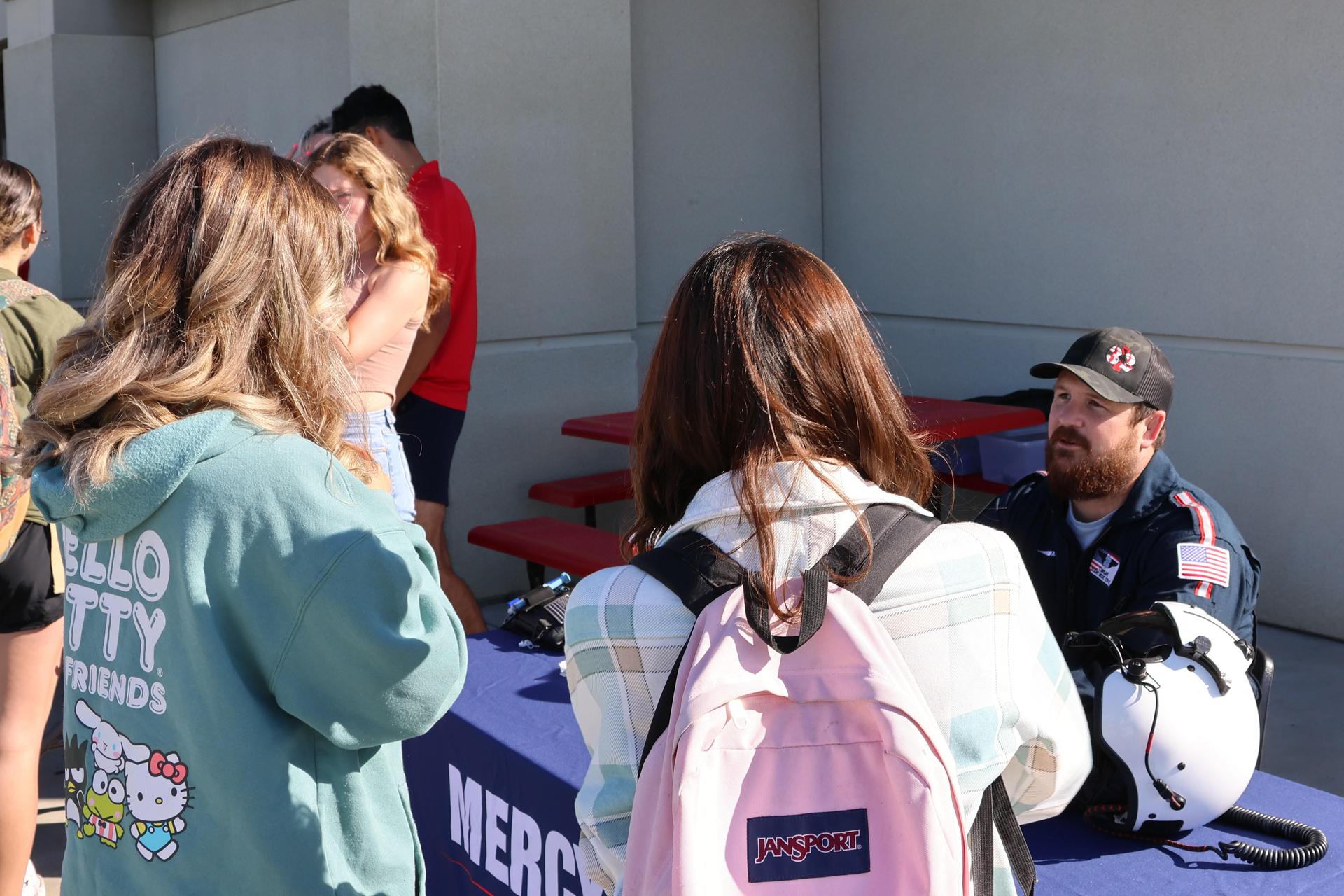 Paramedic talking to students