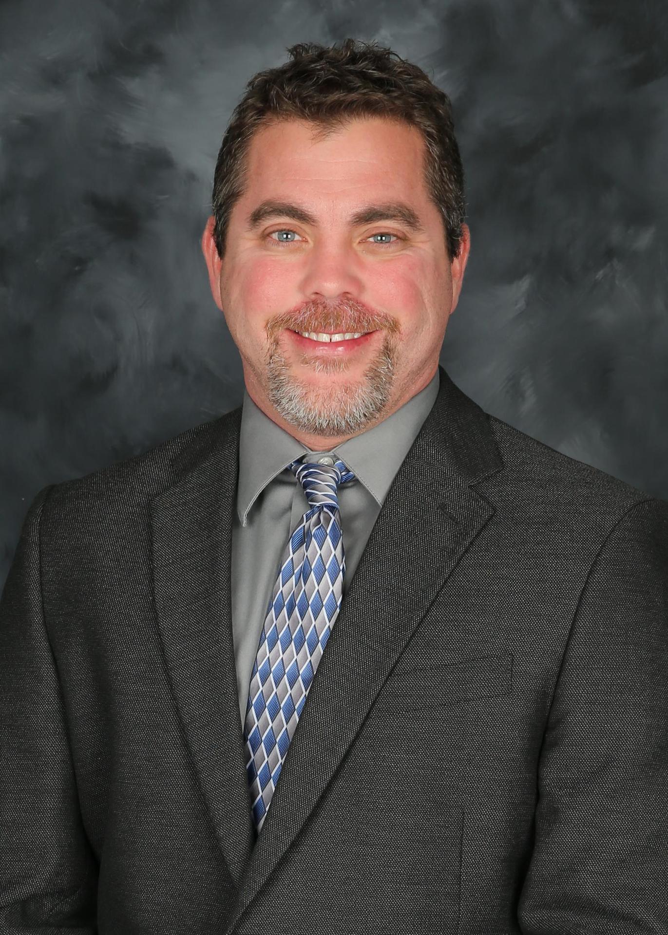Headshot of Dr. Brandon Fletcher.