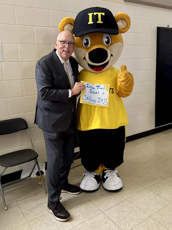 Tom Skilling at Indian Trail School with school mascot Scout.