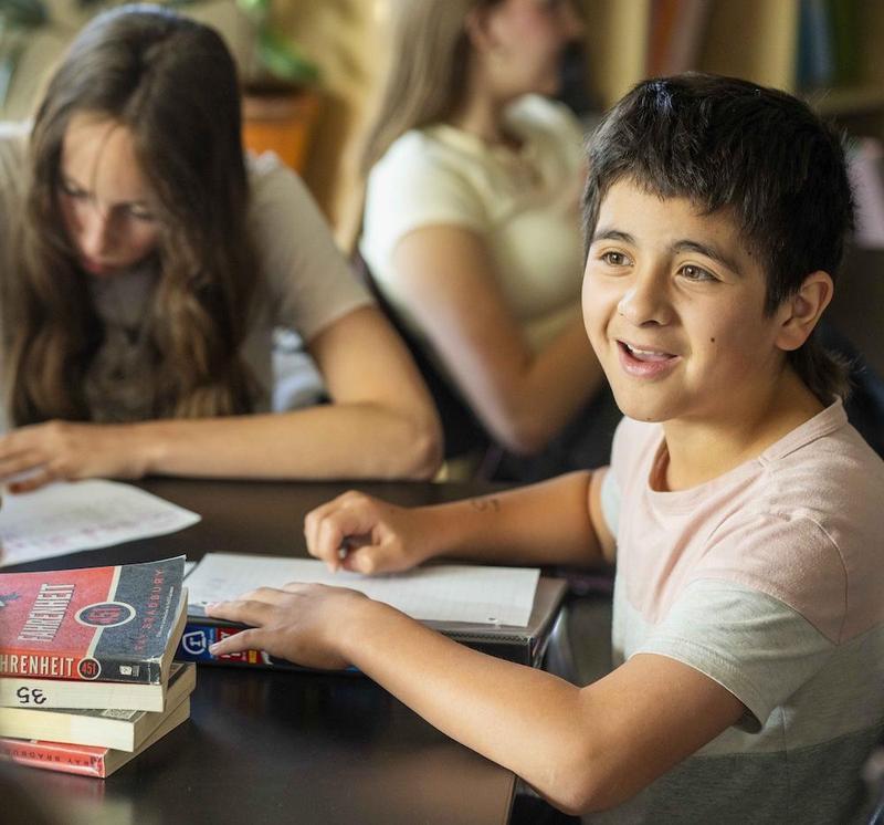 Two students sitting at desk working