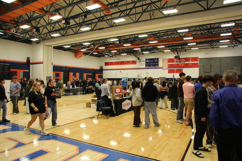 Local business and industry representatives speak with students during the Career Fair