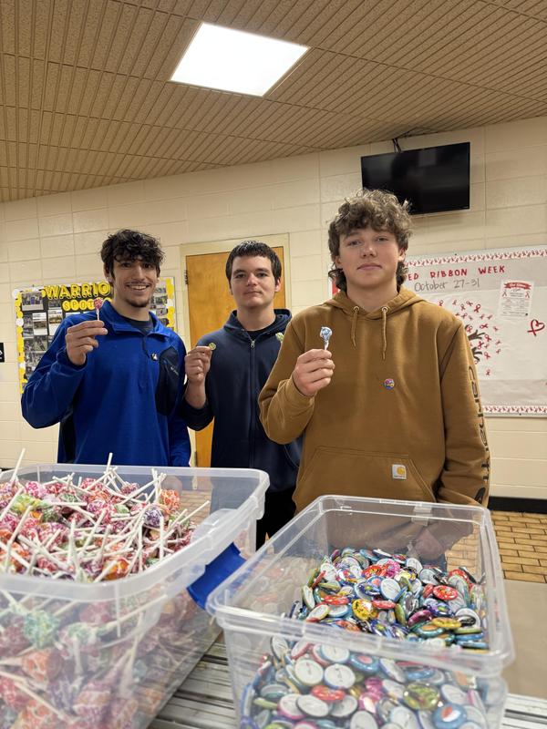 Three boys getting dumdums