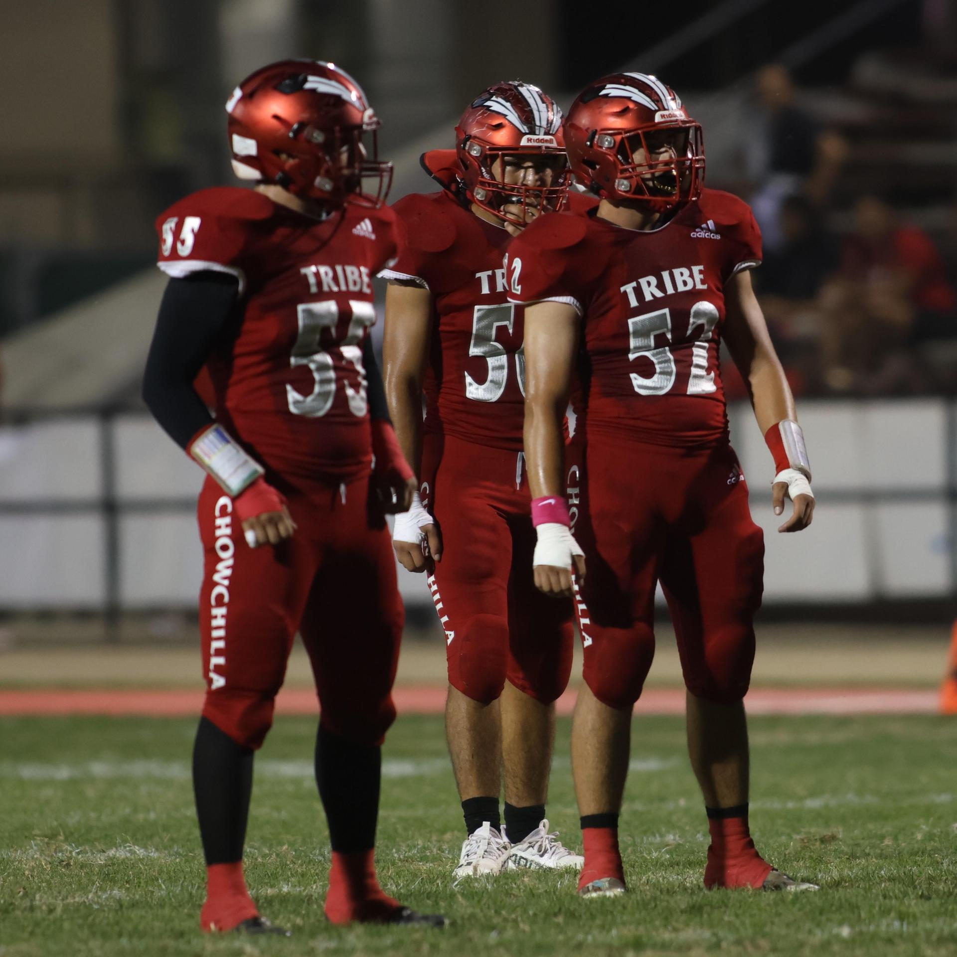 varsity boys playing football against Fowler