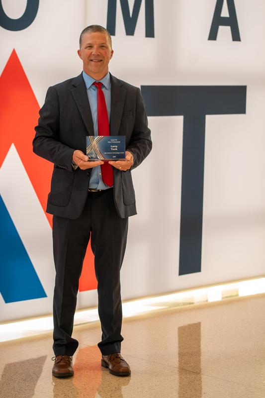 Mr. Tuck Standing and Holding Award
