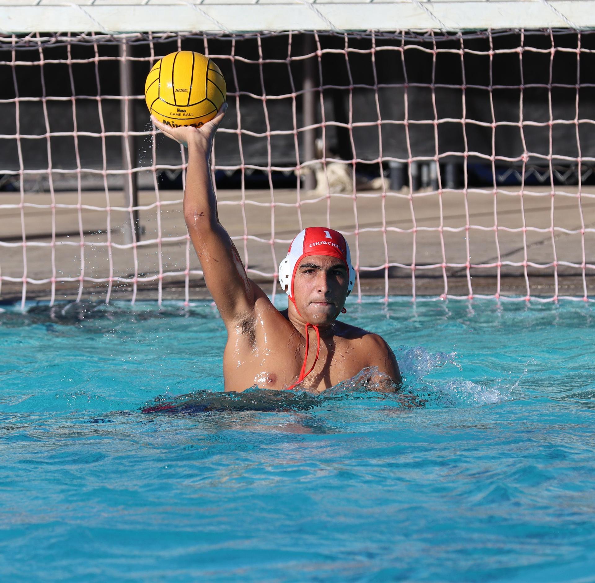 boys water polo players in action against san joaquin memorial