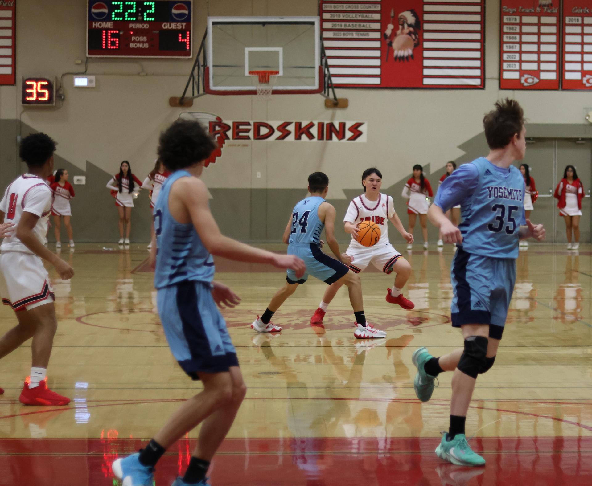junior varsity boys playing basketball against yosemite