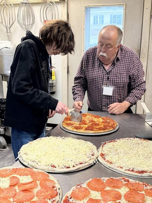 Craig Whites a PEP student make a pizza