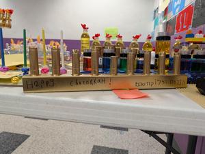 A menorah from pipes and duct tape