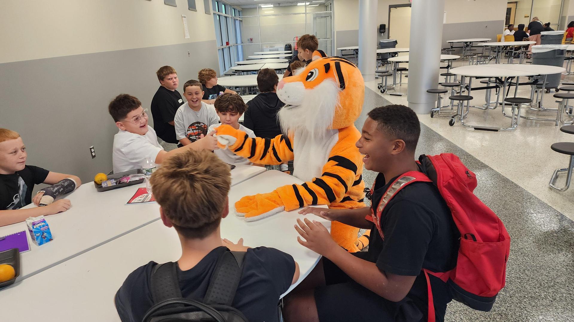 Benny the Tiger and students at lunch