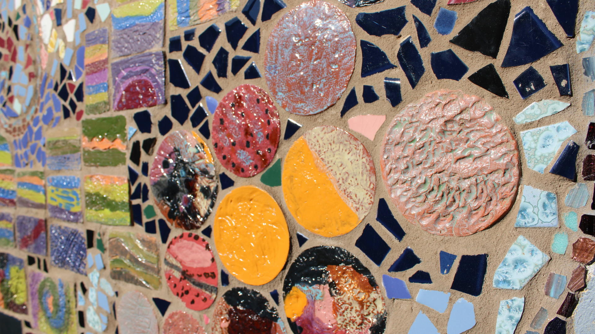 A colorful mosaic wall made of tile.