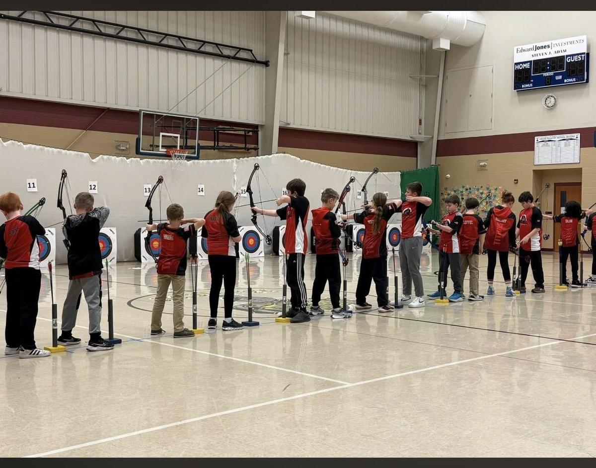 St. Louis Archery team getting bows ready for their shot.