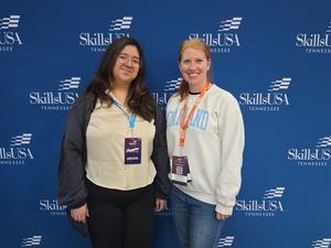 Smiling students with awards