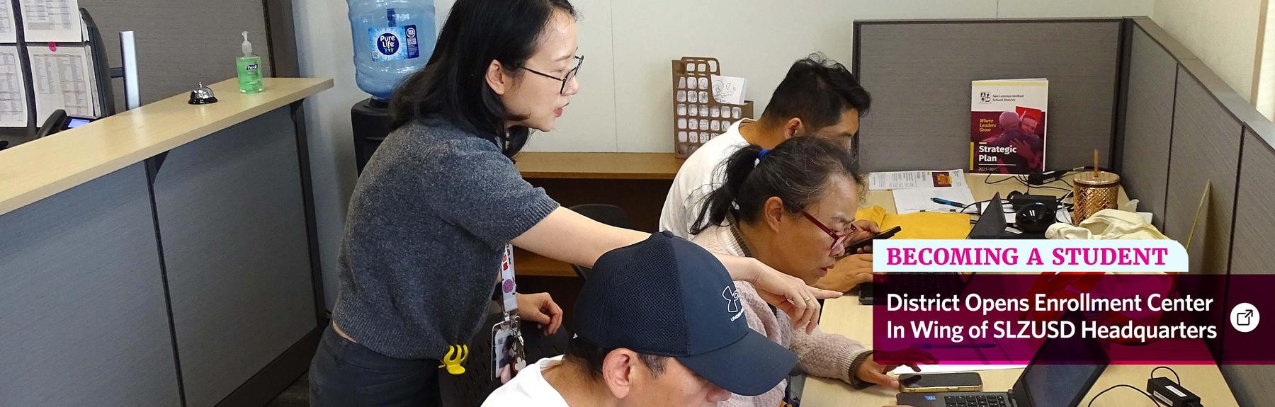 An SLZUSD Chinese-language translator assists family members in the Enrollment Center.