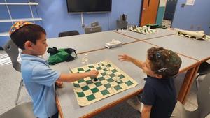 Two boys playing chess