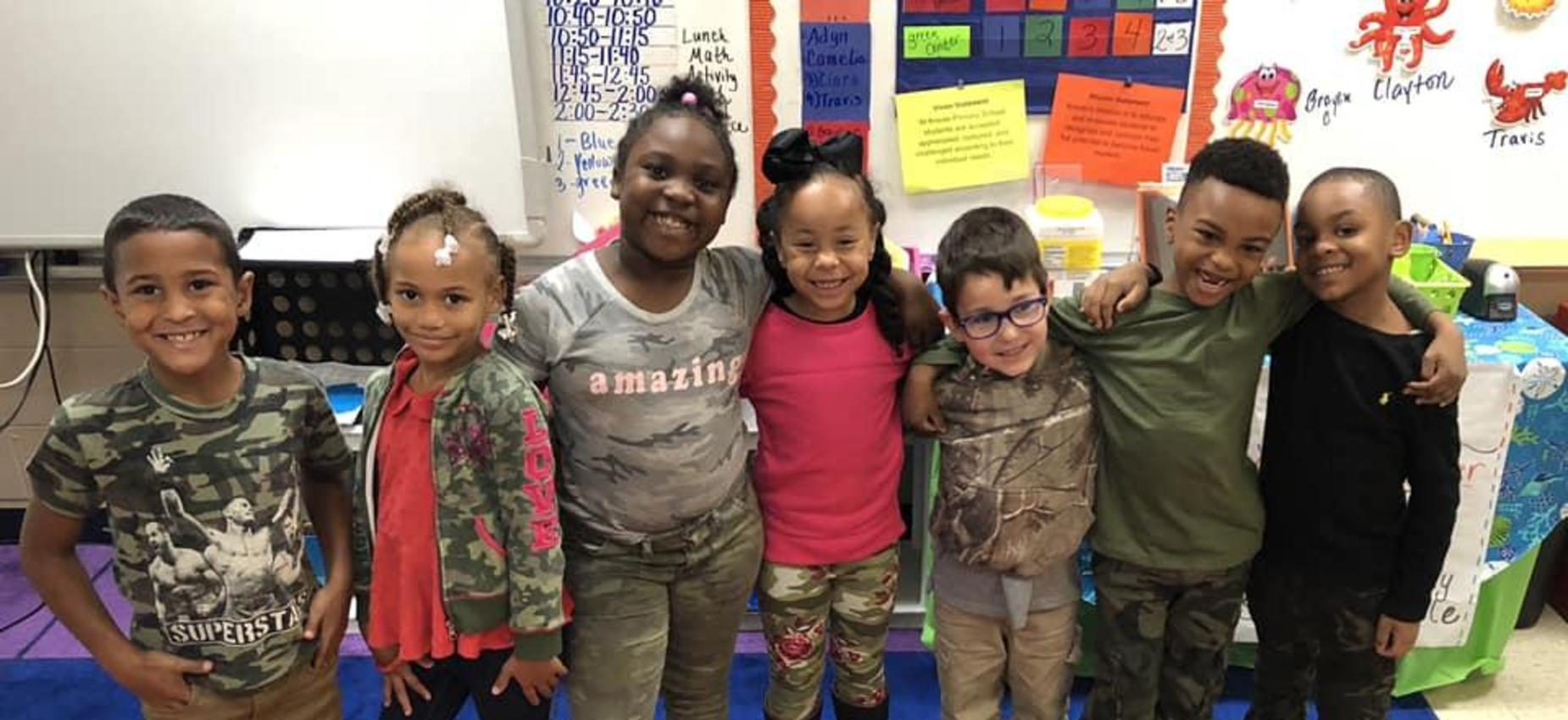 kids lined up in camo
