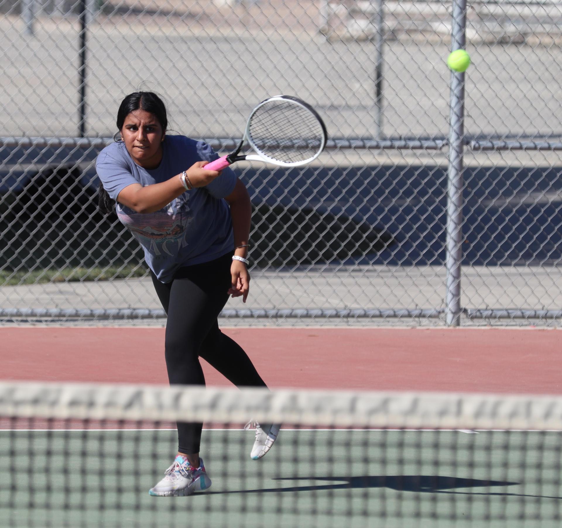 girls playing tennis against Golden Valley