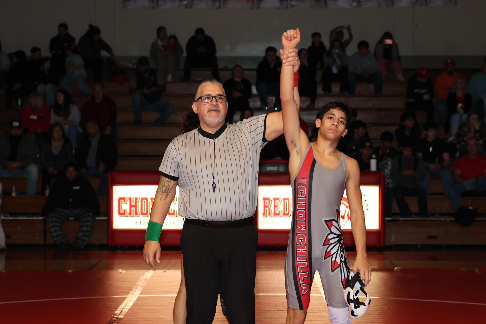 Wrestling winners with hands up 23