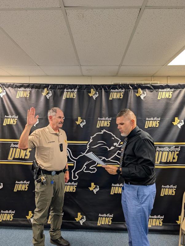 Mr. Everett swearing in Gary Guthrie.