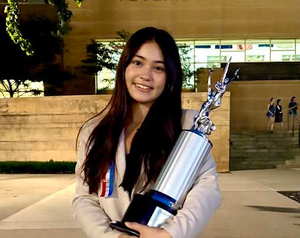 Ava Dinapoli - Valencia High School, a young woman with long dark hair smiles holding a trophy