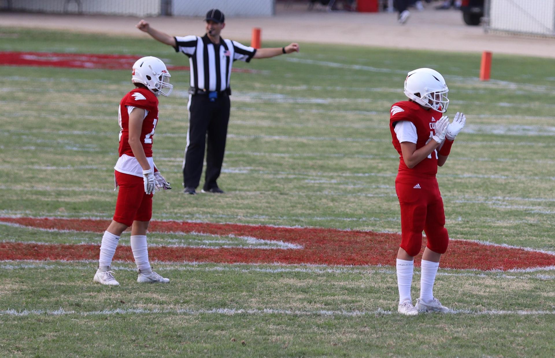 junior varsity football players in action against riverdale