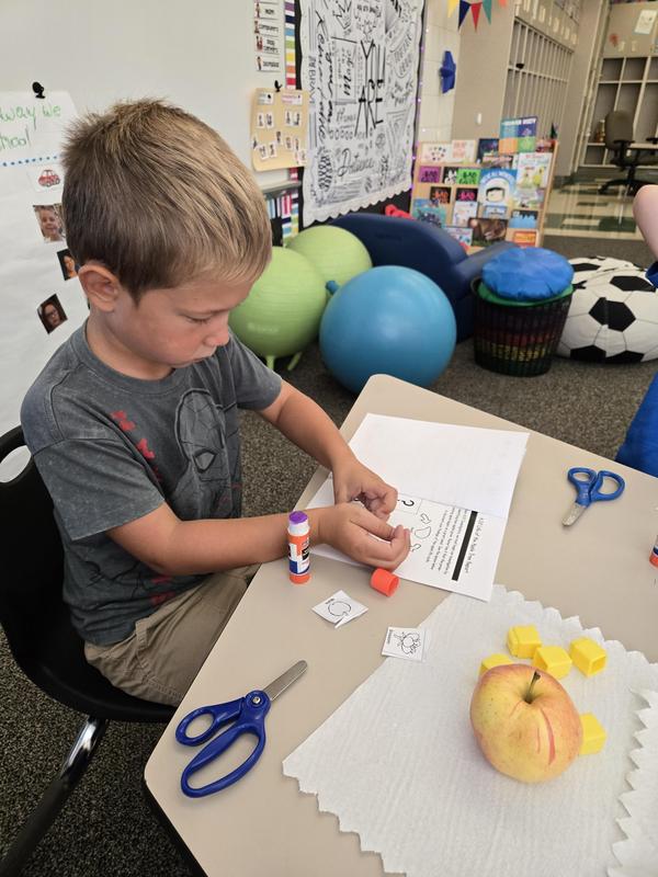 Students help find the prized apple
