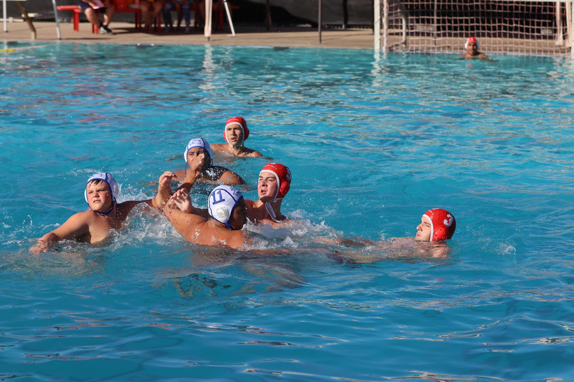 boys playing water polo against Madera