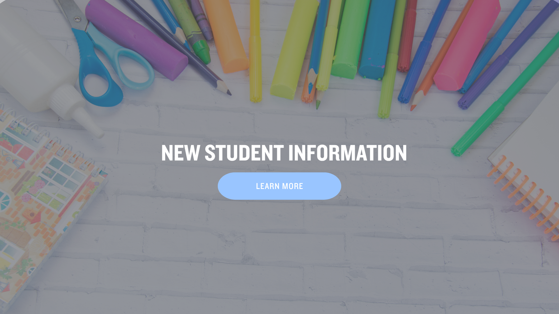 Colorful school supplies arranged on a white background with text for new students.