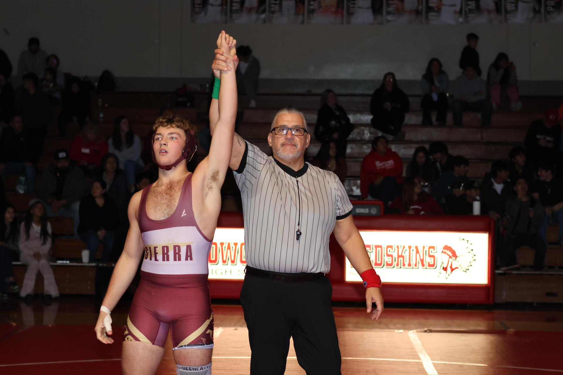Wrestling winners with hands up 37