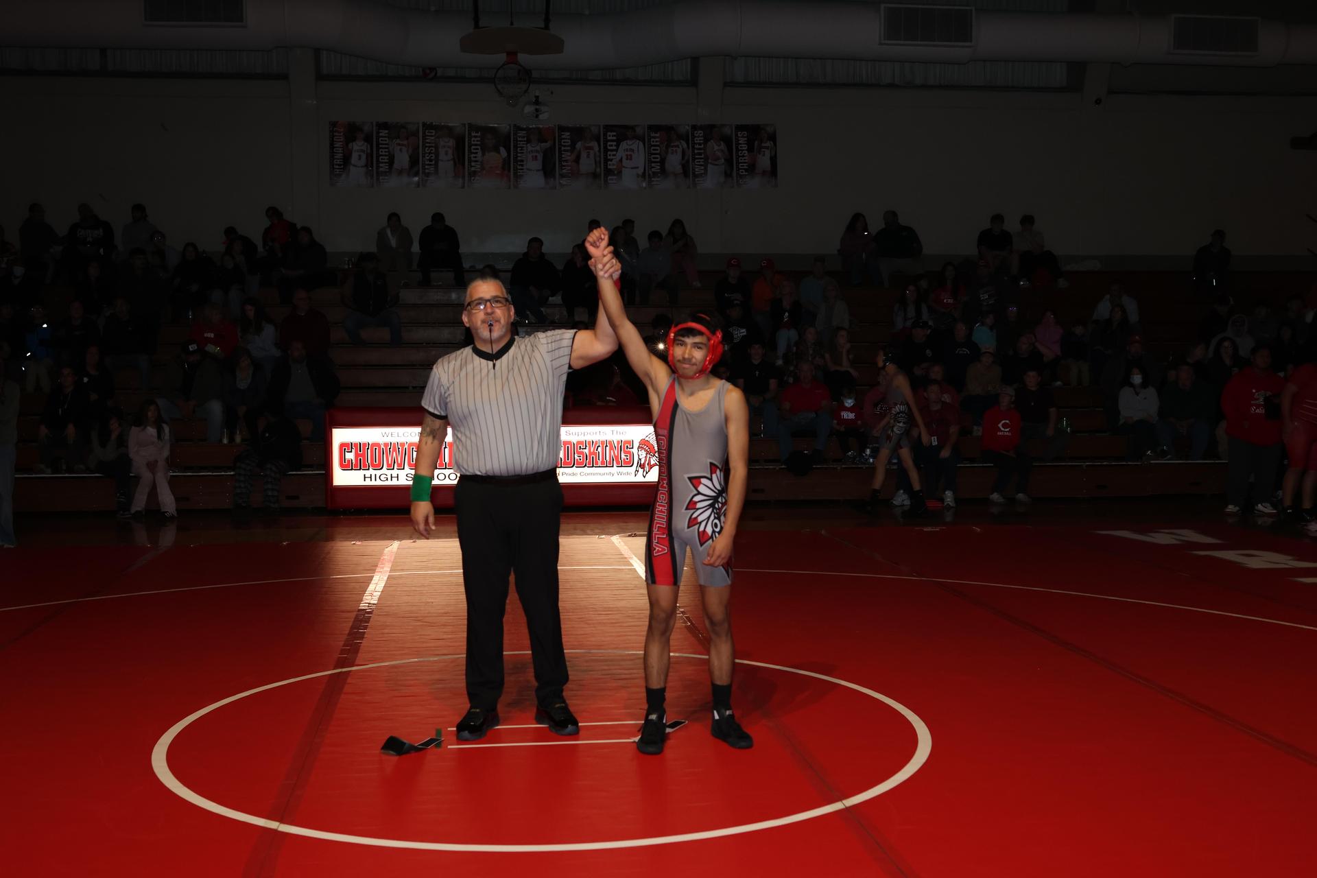 Wrestling winners with hands up 18