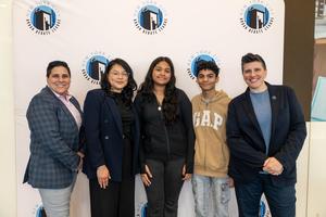 A group of students celebrating at the Urban Debate Tournament