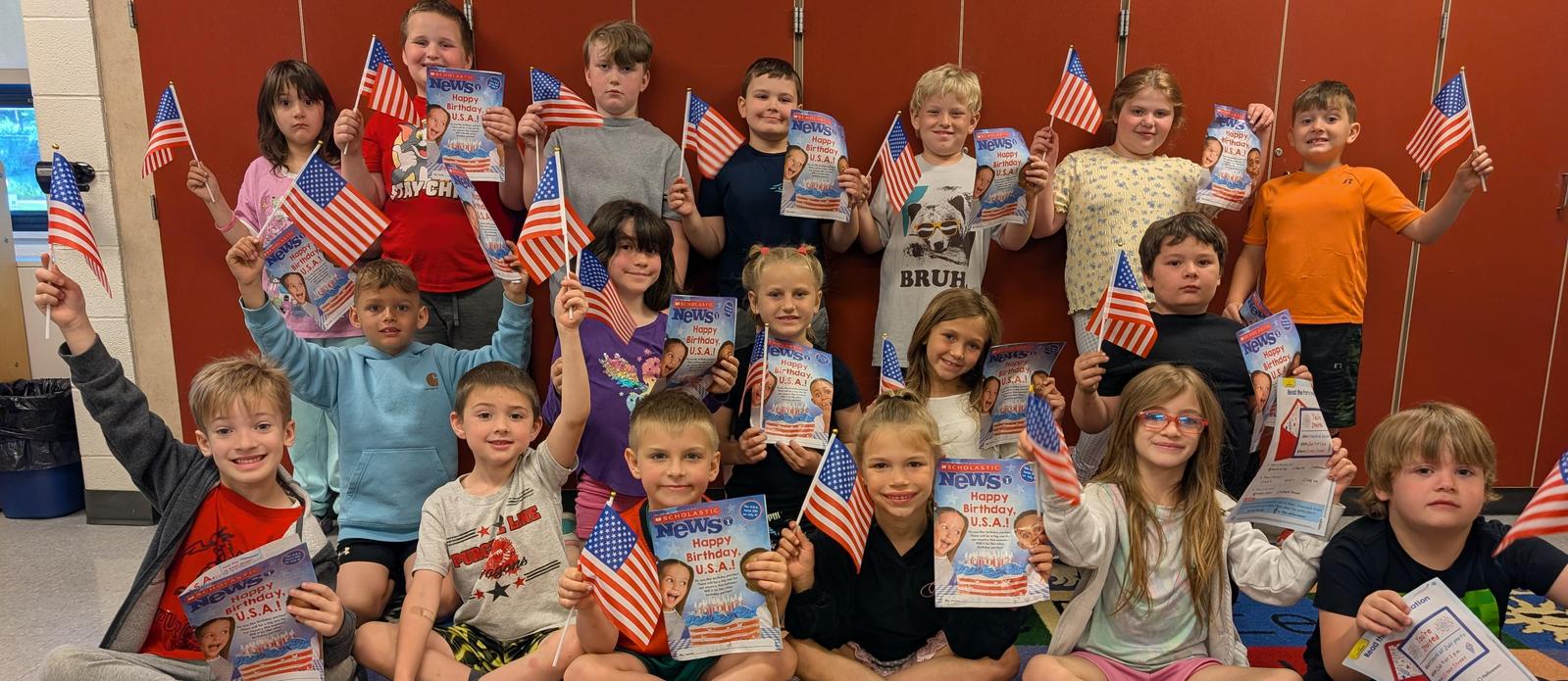 Students with small america flags