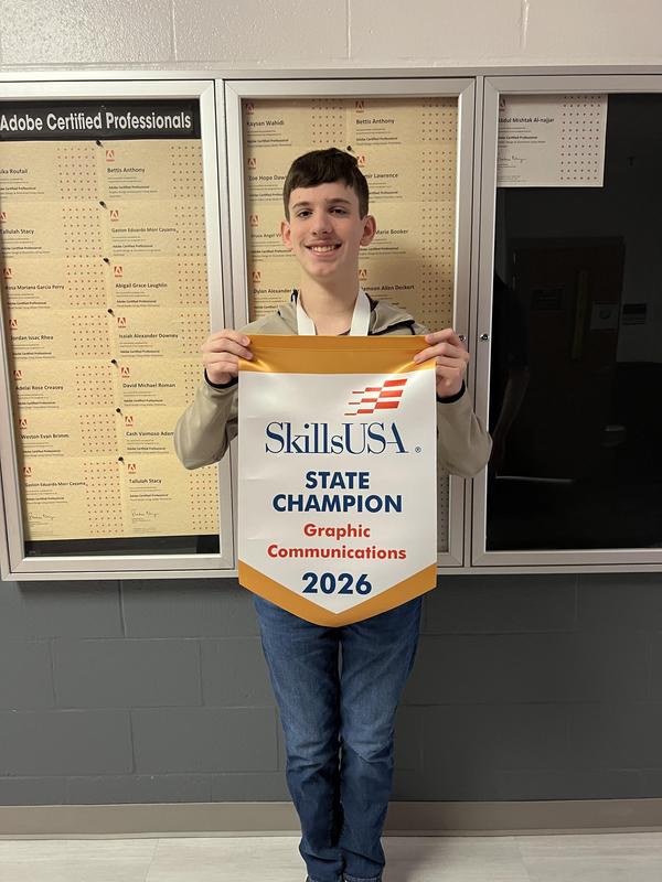 Smiling students with awards