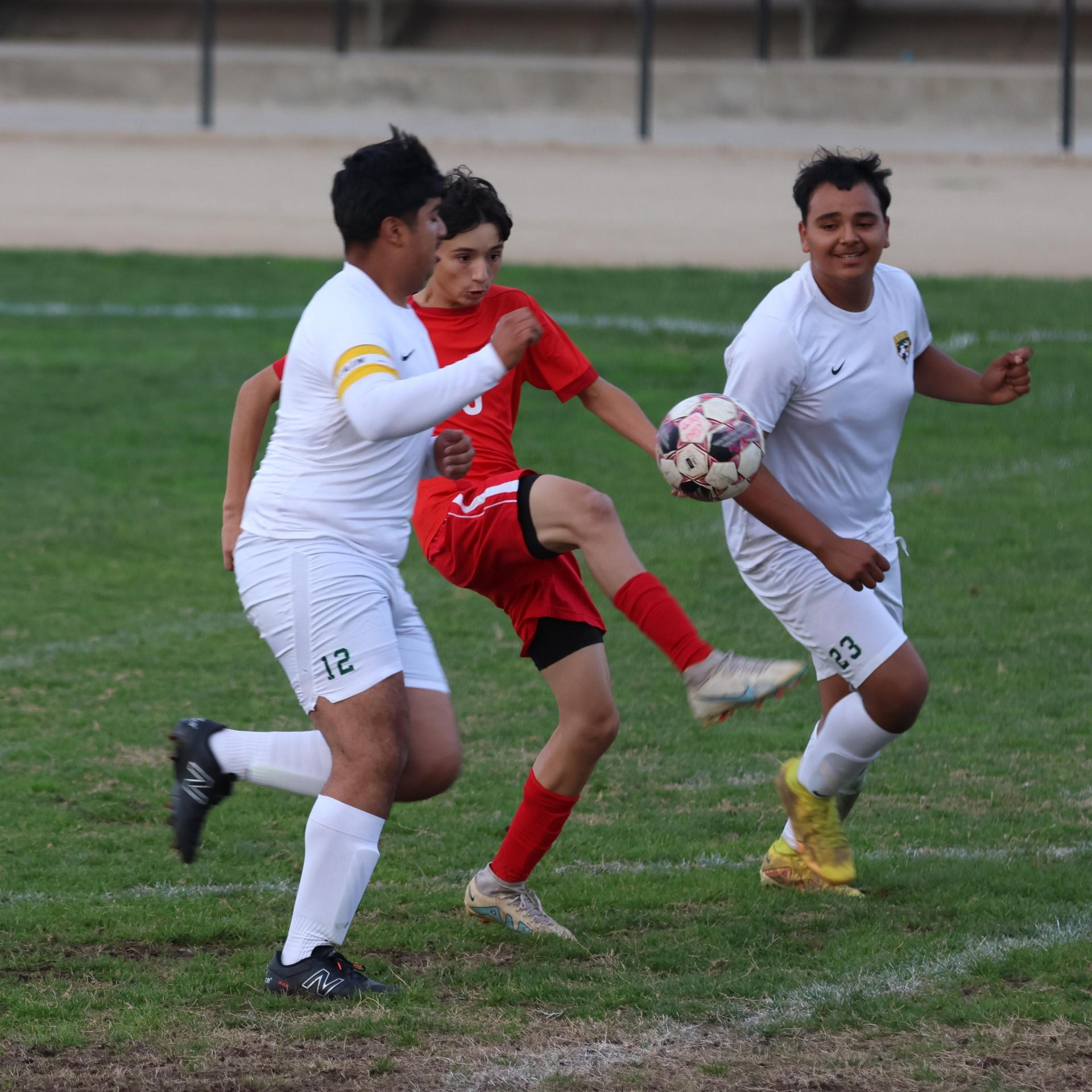 Junior Varisty boys playing soccer against Kingsburg