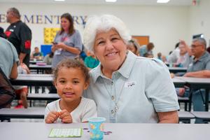 Grandmother with young student at Legay Elementary Bingo event