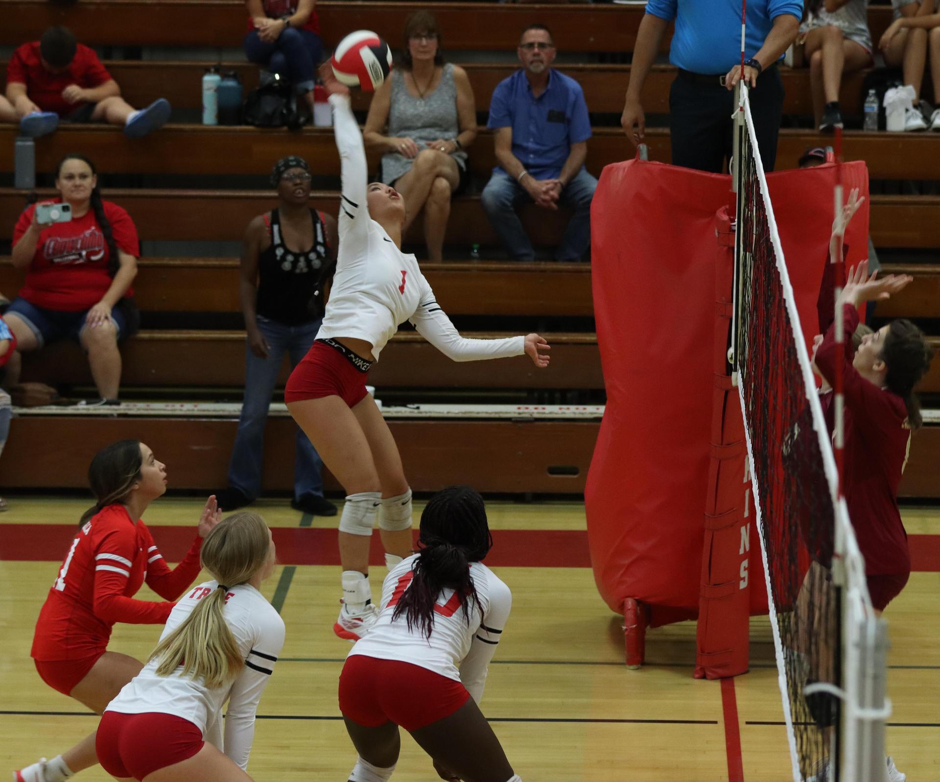 varsity volleyball players in action against golden valley