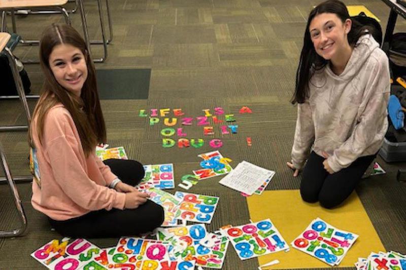 Seniors Rachel Ambrose and Delaney Price work on a SADD Club project