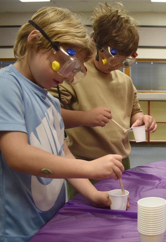 young students conducting science experiments