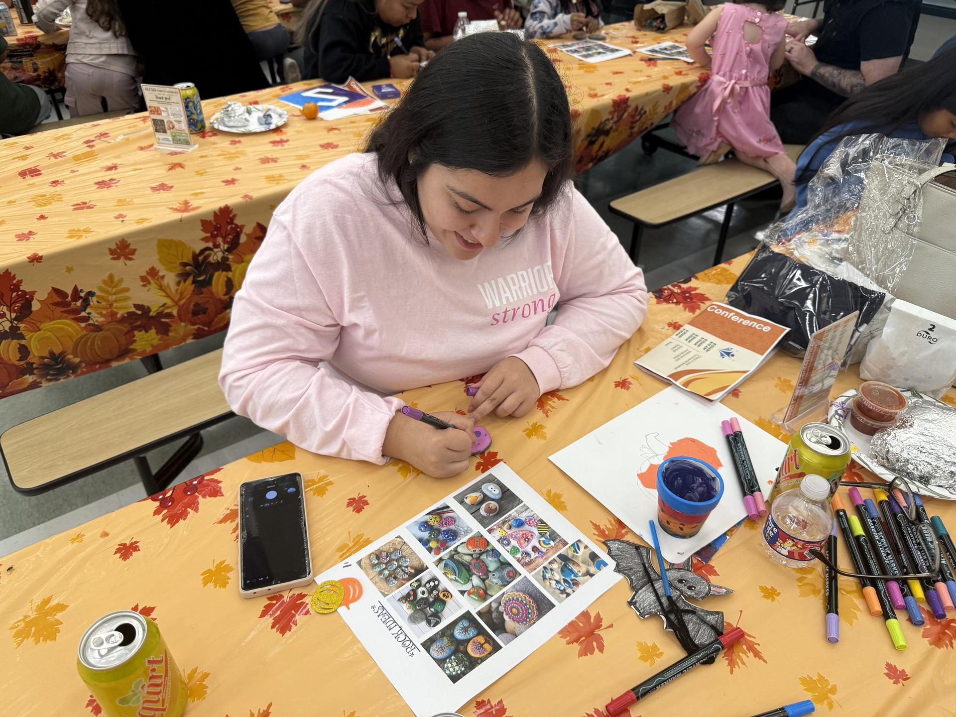Parents drawing on rocks
