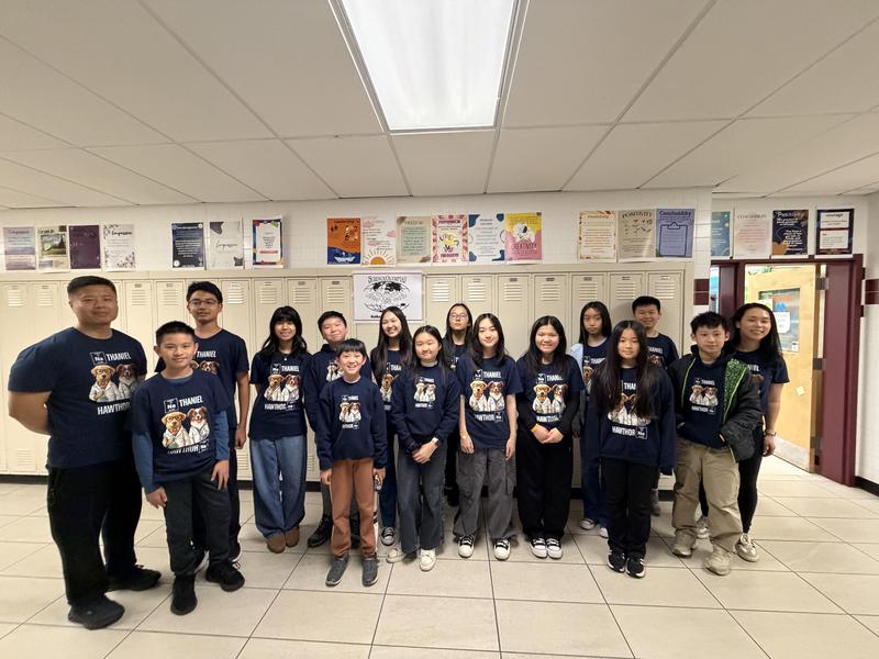 A group of students standing in a straight line for a picture