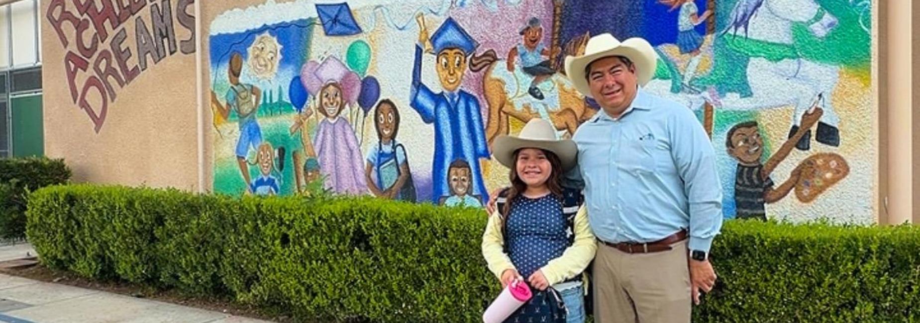 vidrio and student in front of school