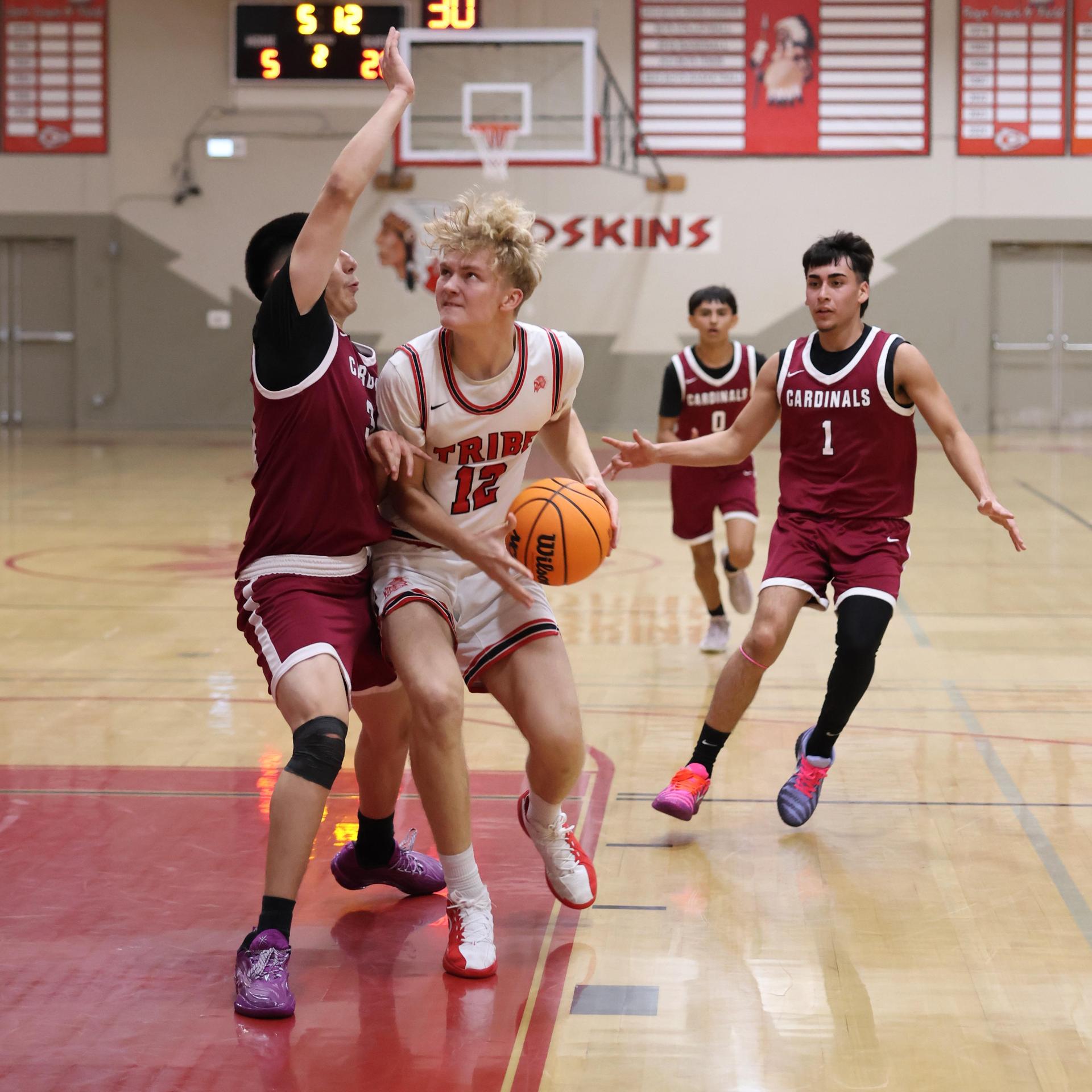 Varsity Boys Basketball playing vs. Orosi 18