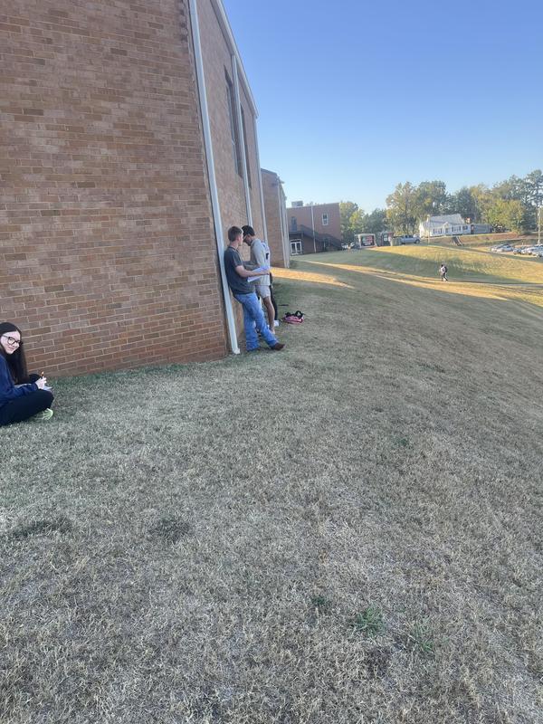 another angle of the students in the back of the library writing