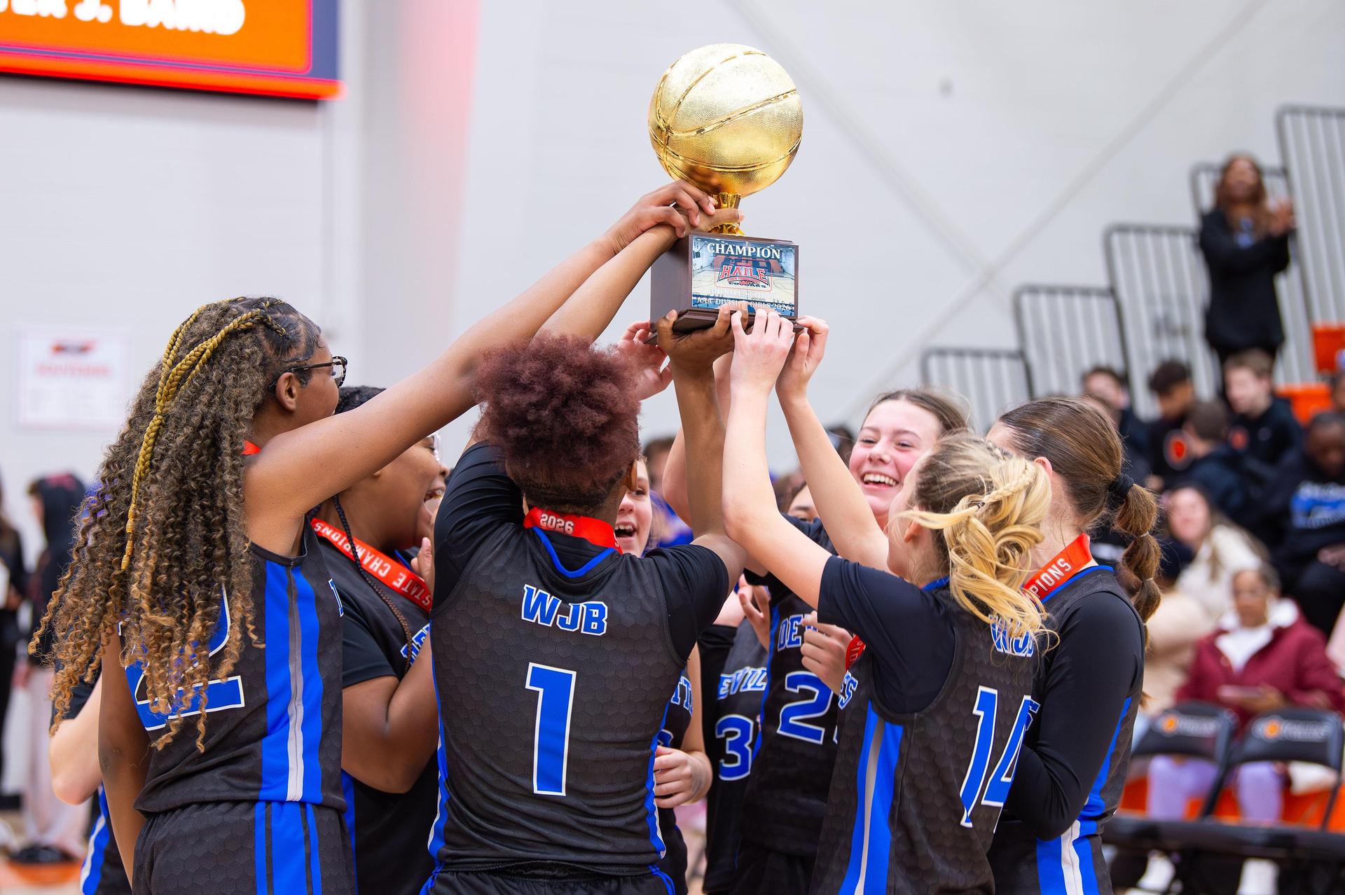 Basketball Team celebrates their 1st place win 