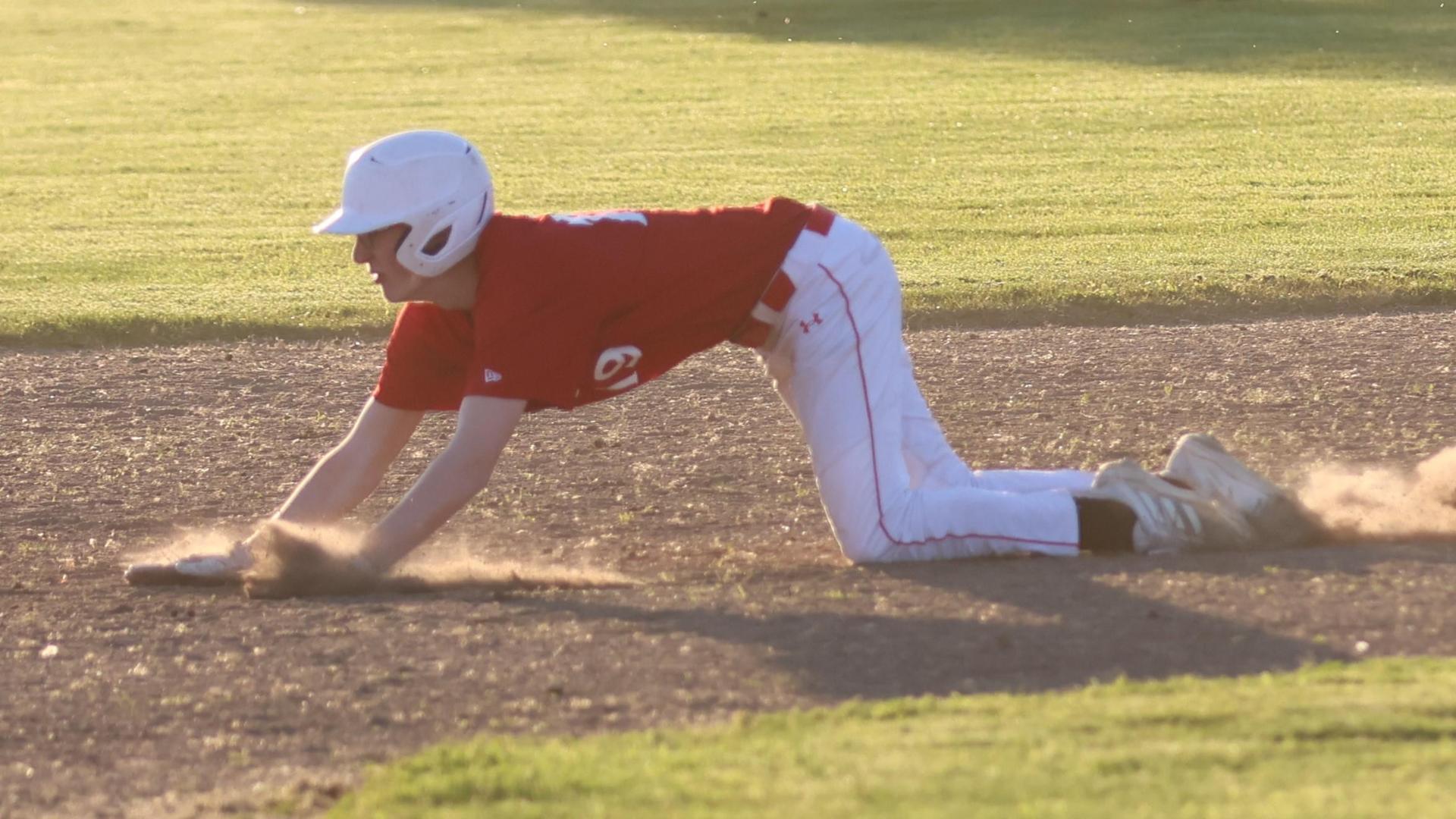 junior varsity baseball players in action