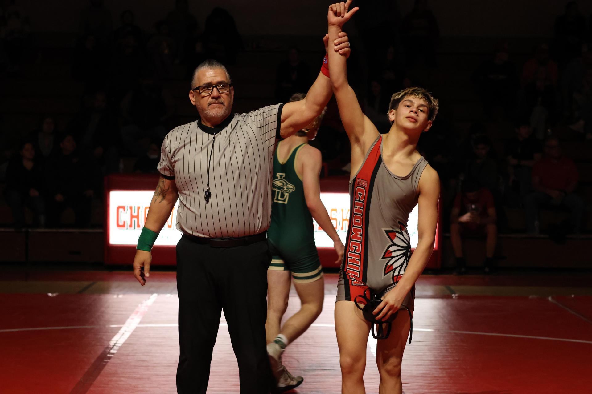 Wrestling winners with hands up 116