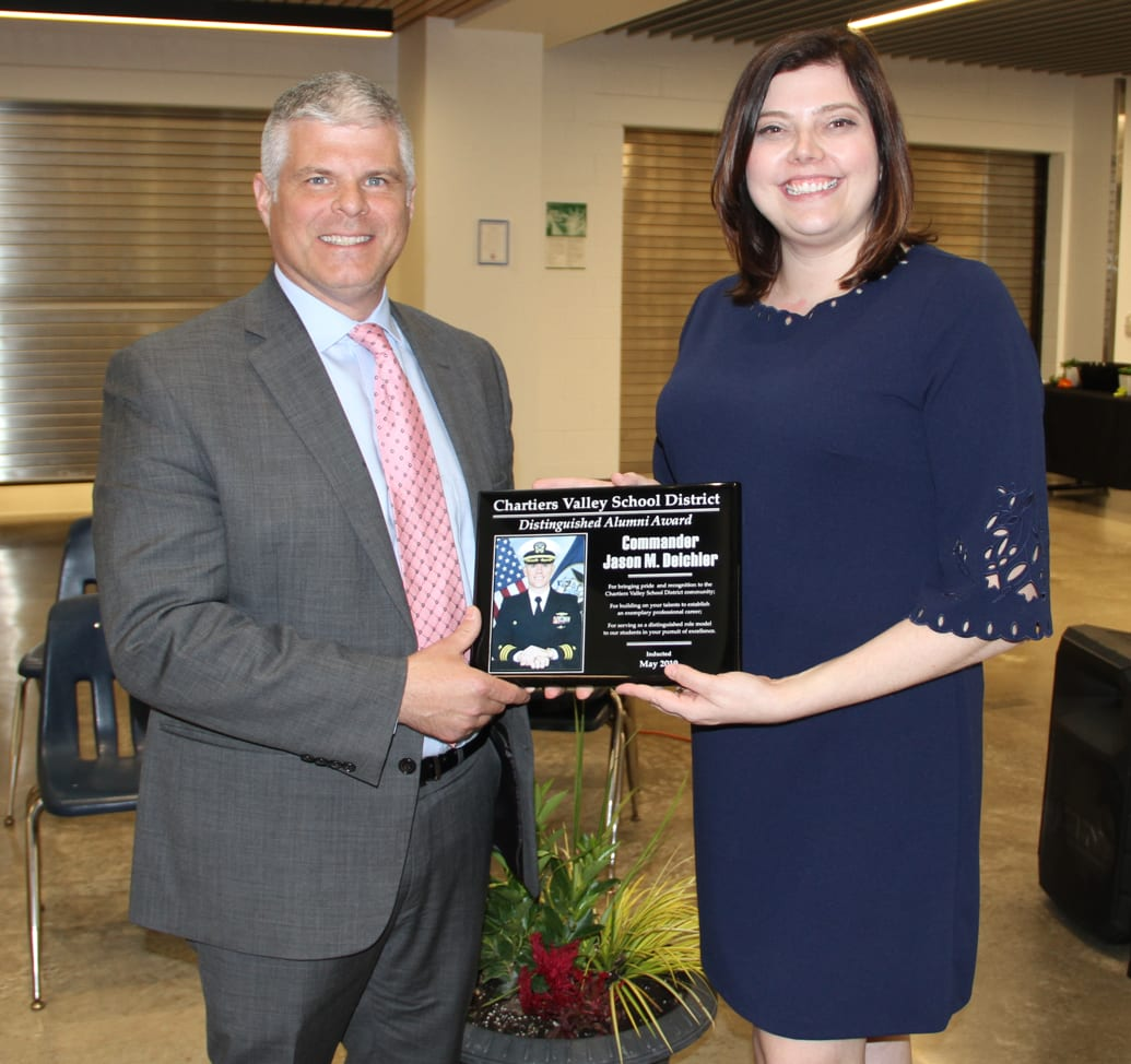 Kristin Deichler accepting award for brother