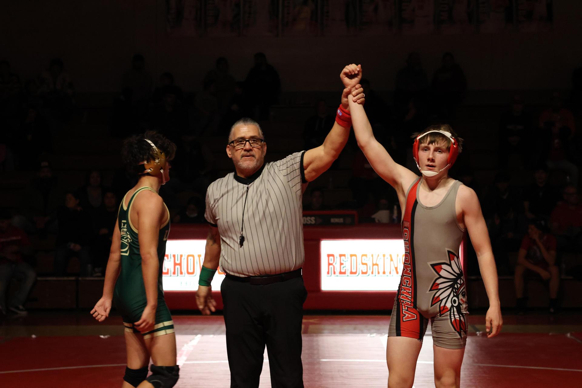 Wrestling winners with hands up 122