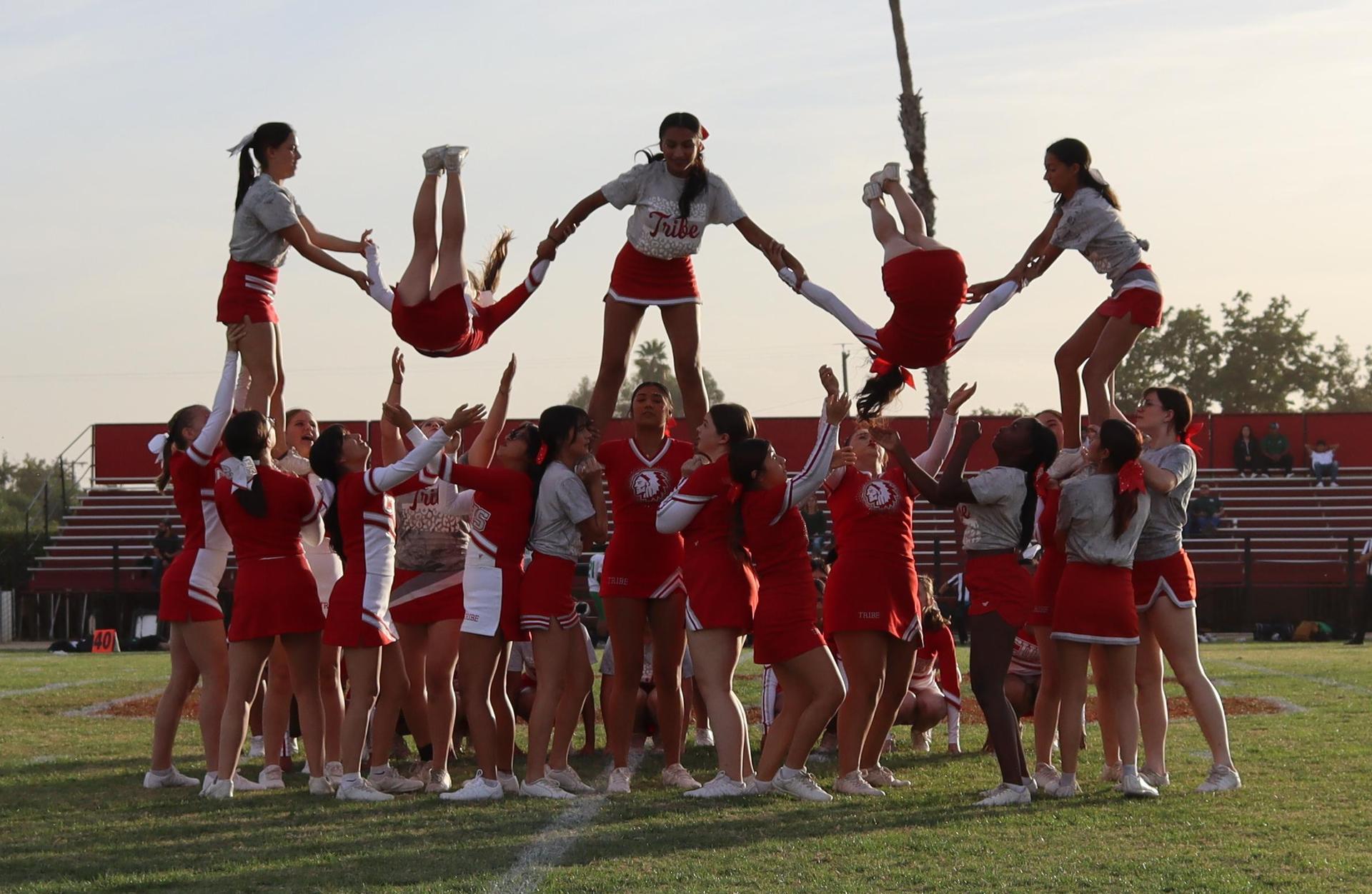 Combined cheer performing at halftime of the football game