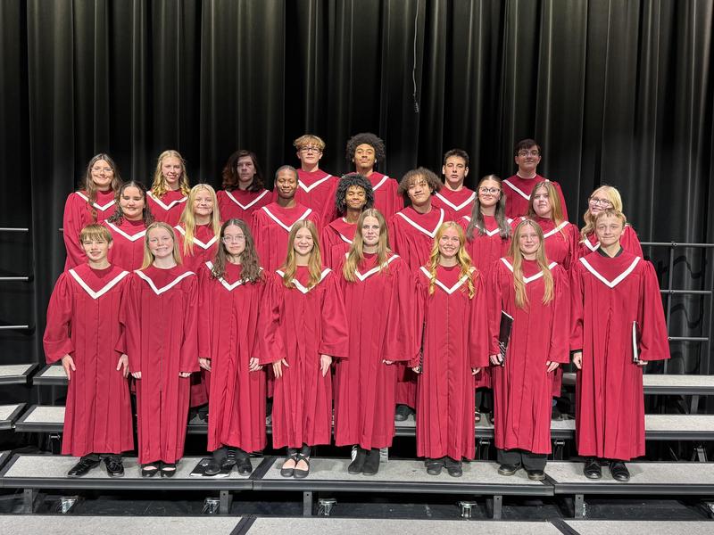 Members of the AAHS Concert Chorus standing on risers.