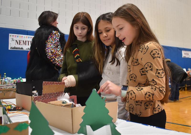 students looking at dioramas based on the movie Home Alone